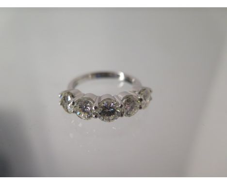 A five stone diamond ring - approx 2.75ct of diamonds set in platinum - ring size M - head size approx 23mm x 5.5mm - diamond