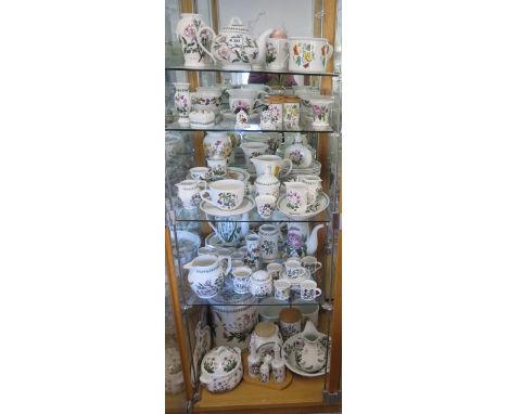 A good collection of Portmeirion Botanic garden table ware including a large bread crock, jugs, vases, storage jars, rolling 