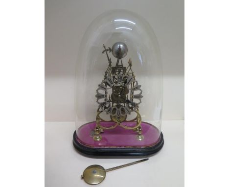 A brass Cathedral  skeleton clock with a chain driven fusee movement striking on a bell under a glass dome and ebonised stand