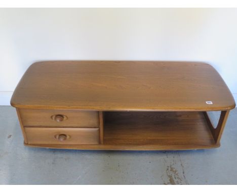 An Ercol two drawer Minerva coffee table, Lucian Ercolaini - Height 40cm x 124cm x 53cm - in good condition 