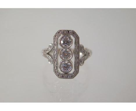 An 18ct white gold diamond Art Deco style ring with three central diamonds each approx 0.24ct - ring size P/Q with spacer - g