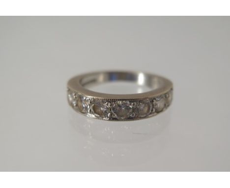 An 18ct white gold seven stone diamond ring size L/M - approx weight 5.7 grams - diamonds bright 