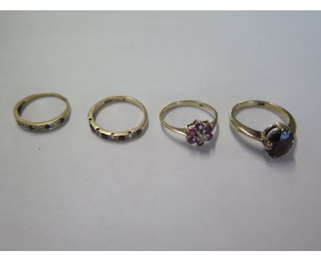 Four 9ct gold rings sizes J,K,M,P - approx total weight 9.2 grams 