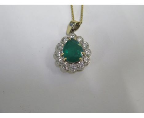 An emerald and diamond 18ct gold pendant approx 17mm x 15mm on an 18ct yellow gold 44cm chain - total weight approx 5.9grams 