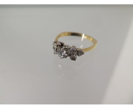 A hallmarked 18ct yellow gold 7 stone diamond ring - the central diamond approx 0.25ct - ring size O - approx weight 3 grams 