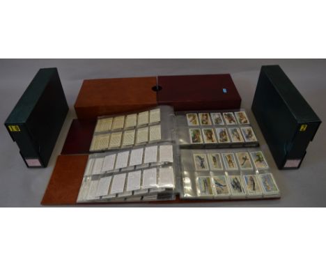 4 Albums containing cigarette cards, most sets complete also includes some partial sets not mentioned. 
-Players Cigarettes: 