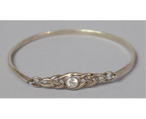 A Silver Bangle with Celtic Knot and Stone Decoration 