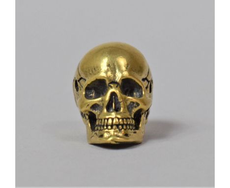 A Small Bronze Study of a Skull, 2cm high 