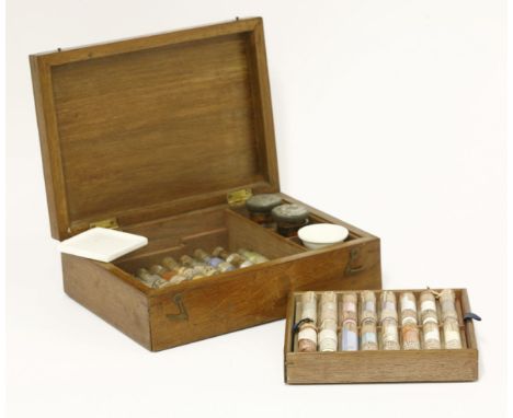 A Victorian mahogany presentation box of ceramic colours,containing twenty-eight glass phials of powder, fifteen labelled 'Wo