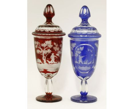 Two Bohemian glass Jars and Covers,late 19th/early 20th century, one blue with two etched oval panels depicting a duck shoot 