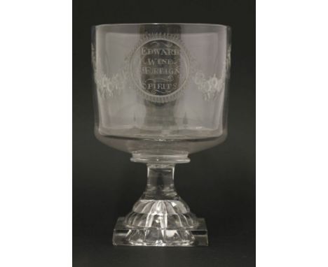 A large Goblet,18th/19th century, engraved with two circular panels, inscribed 'Edwards Wine Foreign Spirits' opposite a crow
