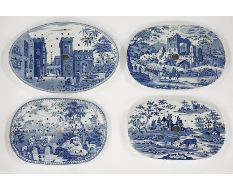 Four blue and white pottery Drainers,one Spode, three unmarked, two of ruins, one with a temple and one with cows watching,31