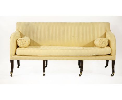 A George III three-seater settee, with a square back raised on eight moulded sabre legs,183cm long (6ft)