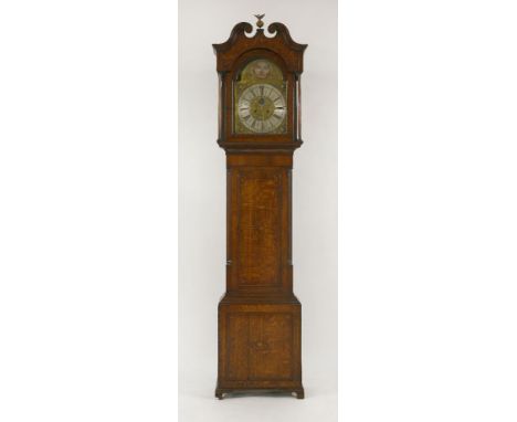 A George III oak and mahogany crossbanded longcase clock,the swan neck pediment with inlaid decoration above an arched brass 
