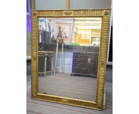 WALL MIRROR, 140cm x 114cm, late Victorian giltwood and gesso with paterae and rosette rectangular frame. 