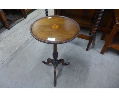 An Edward VII inlaid mahogany tripod wine table 