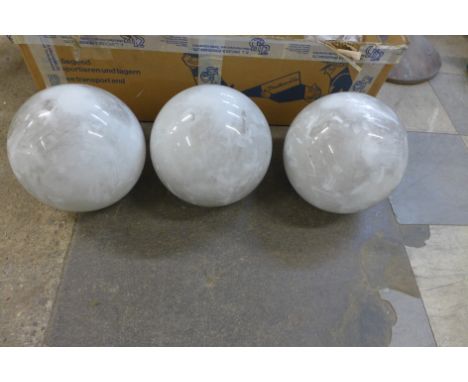 A set of three glass light shades 