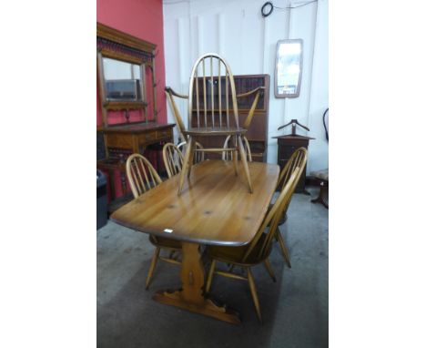 An Ercol Golden Dawn elm and beech refectory table and six Quaker chairs 