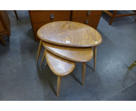 An Ercol Blonde elm and beech pebble shaped nest of tables 