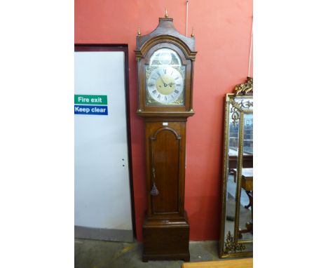 A George III Lancashire oak 8 day longcase clock, the 12 inch arched brass dial signed Raynor, Bury 