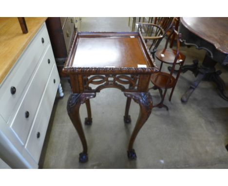 A Chippendale Revival carved mahogany jardiniere stand 