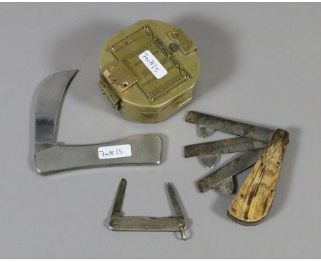 A brass military marching compass and two pocket knives along with a cased fleam.