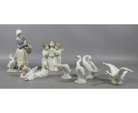 A collection of seven pieces of Lladro including lady with geese, set of four geese, three cherubs and a single cherub.