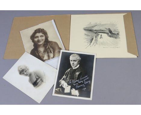 A collection of autographed film star portrait pictures.