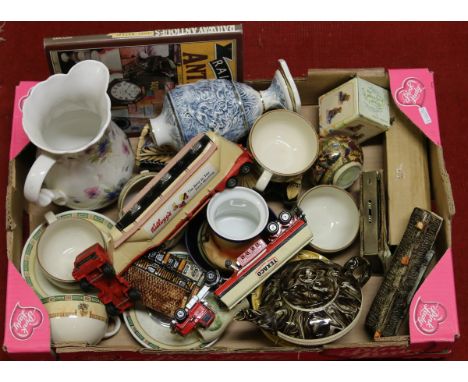 A box of ceramics and collectables including two Matchbox Diecast Lorries and a Macintyre agate ware teapot.