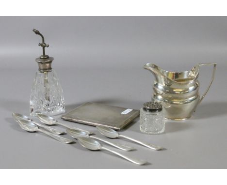 A collection of silver items to include Georgian style helmet shaped cream jug, set of teaspoons, cigarette case etc.