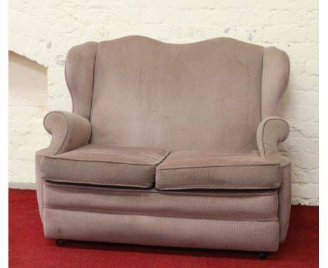 A two seat wing back sofa.