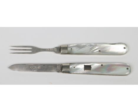 A late Victorian campaign interlocking folding silver knife and fork eating set with mother of pearl scales. Assayed Sheffiel