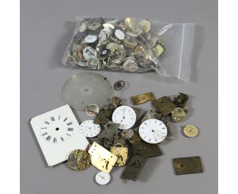 A box of assorted wristwatch movements and carriage clock spares.