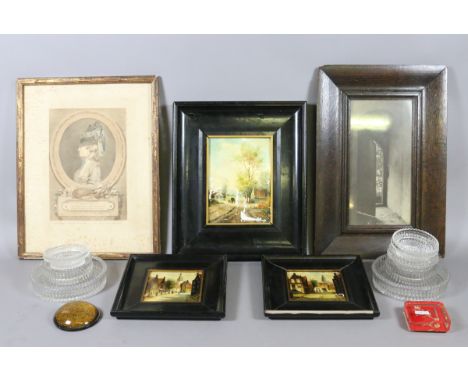 A box and contents of three framed ceramic pictures and two framed prints along with glassware and paper weights.
