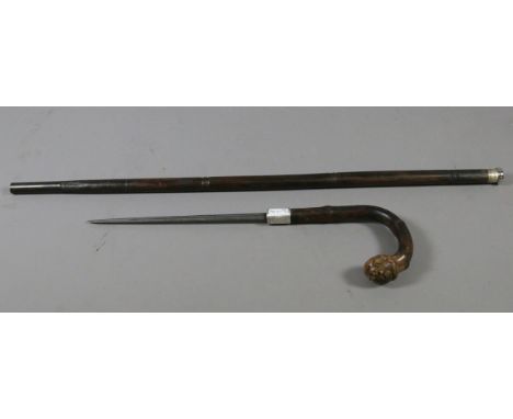 An assembled bamboo sword stick with silver collar.