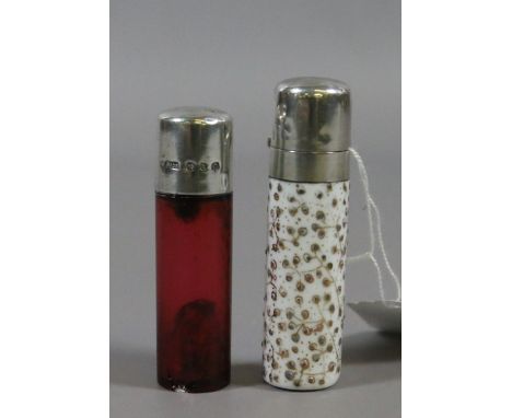 A Victorian silver topped and cranberry glass purse scent bottle assayed Birmingham 1876 along with another ceramic and white