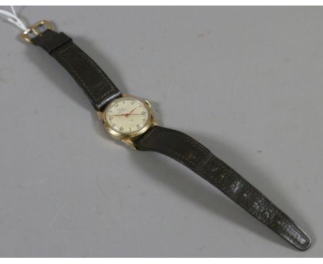 A 1960s ladies/gents solid 9ct gold record manual wristwatch on leather strap, assayed London 1963.