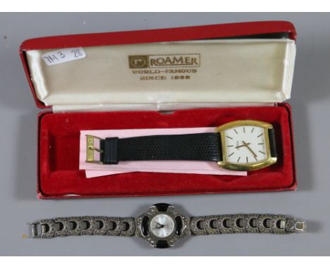 A ladies silver and marcasite cocktail watch along with a gentlemens Roamer wristwatch with baton markers.