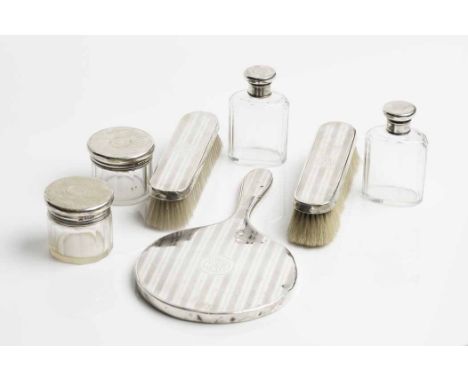 EDWARDIAN SILVER PART DRESSING TABLE SET
maker's mark 'ED', also marked Drew & Sons, London 1903, comprising a hand-mirror, t