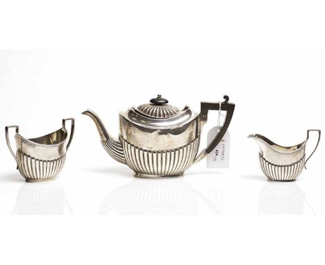 LATE VICTORIAN SILVER THREE PIECE BACHELOR'S TEA SERVICE
maker John Henry Potter, Sheffield 1899, of partially gadrooned oval