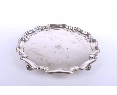 GEORGE V SILVER SALVER
maker R & W Sorley, London 1924, with serpentine rim, engraved with central intial 'S', bearing presen