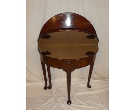 An early 19th Century mahogany semi-circular double opening turnover-top card and tea table with baize lined playing surface 