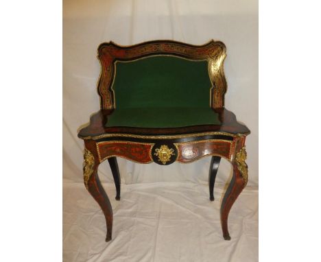 A 19th Century French boulle brass and tortoiseshell inlaid serpentine fronted turn-over top card table with baize lined play