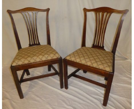 A set of six 19th Century mahogany Chippendale-style dining chairs with pierced vase splat backs and upholstered seats on squ