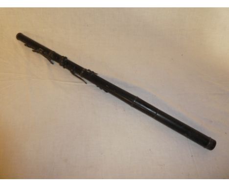 An old ebony flute by Rudall &amp; Rose of London with silver plated mounts