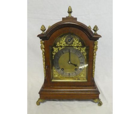 A good quality striking bracket clock by W &amp; H with  gilt and silvered arched dial in polished oak and brass mounted arch