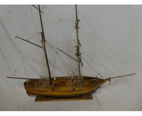 A wooden scale-built model of a two masted sailing ship "Le Hussard" 26" long