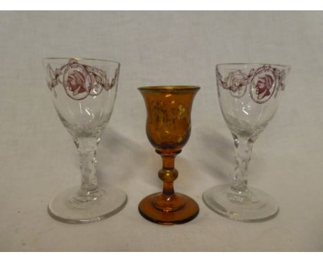 A pair of 19th Century glass goblets with painted portrait and swag decoration, 5" high and one other brown tinted glass gobl