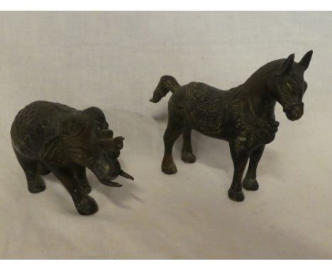 An Eastern bronze figure of a horse 6½" long and one other similar figure of an elephant (2)