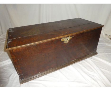 A George III oak rectangular trunk with two internal drawers and candle box enclosed by a hinged lid, 38" wide